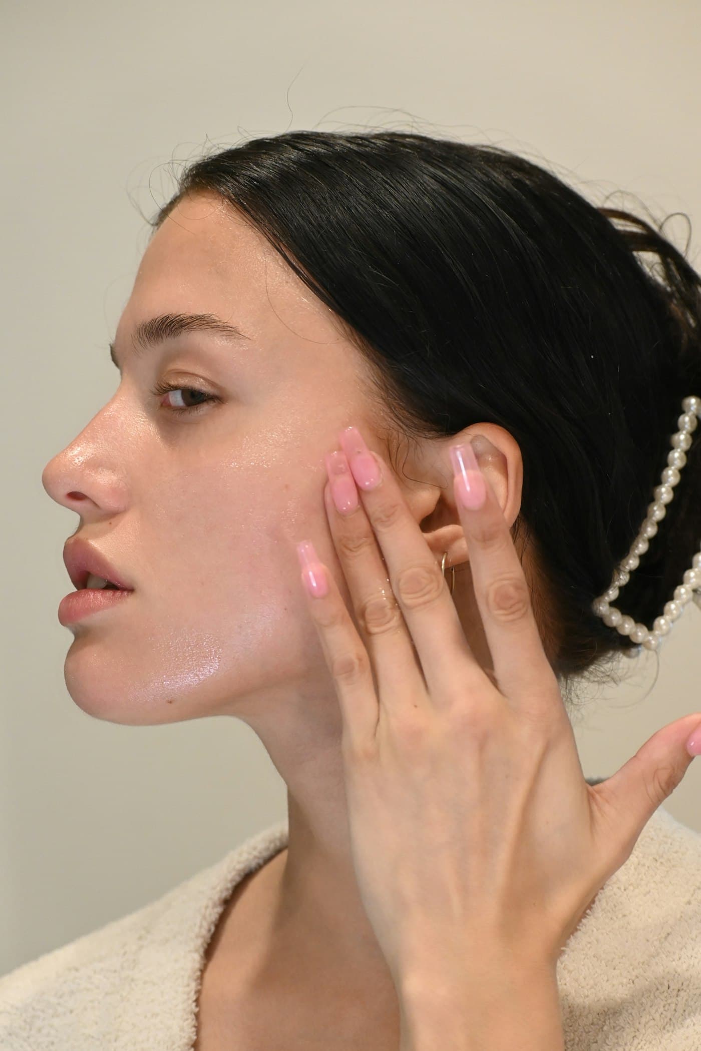 Model with glowing, healthy skin in low evening light